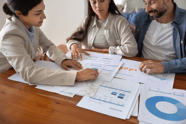"Mortgage advisor explaining Home Advantage Program options to a buyer"
